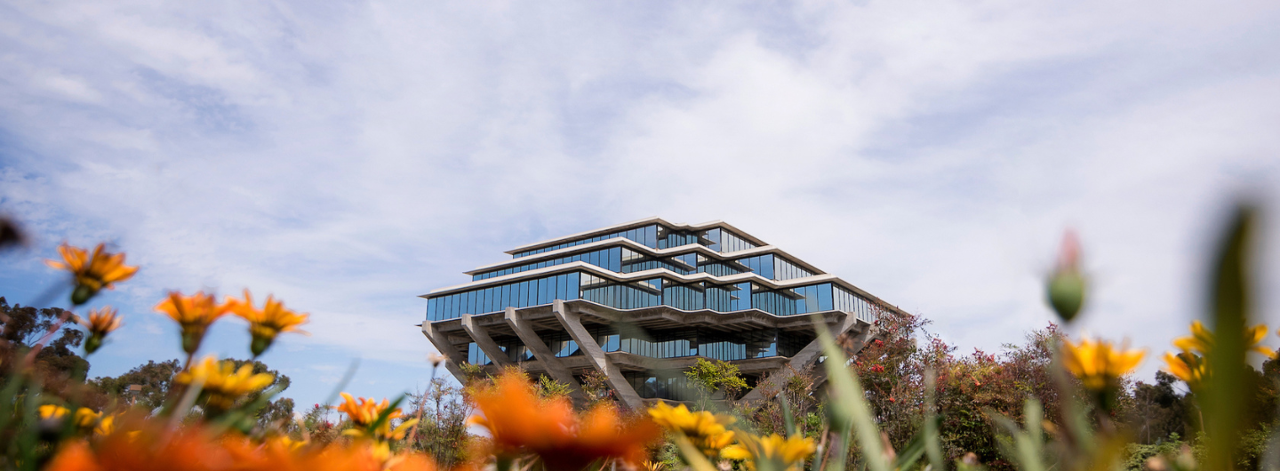 Geisel Library with orange flowers in the foreground